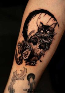 Black work black cat tattoo